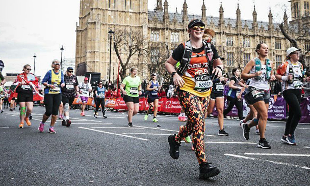 Image shows Optometrist and Primary Eyecare Services’ Clinical Lead, Helen McKrell running past Big Ben at the 2024 London Marathon.